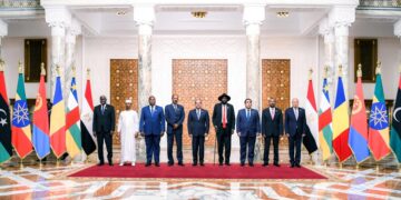 This handout picture released by the Egyptian Presidency shows (L to R) African Union Commission head Moussa Faki Mahamat, Chad's President General Mahamat Idriss Deby, Central African Republic President Faustin-Archange Touadéra, Eritrea's President Isaias Afwerki, Egypt's President Abdel Fattah al-Sisi, South Sudan's President Salva Kiir Mayardit, the Chairman of the Tripoli-based Libyan Presidential Council Mohamed al-Menfi, Ethiopia's Prime Minister Abiy Ahmed, and Arab League Secretary-General Ahmed Aboul-Gheit posing for a family photo during a regional summit for neighbouring nations impacted by the three-month war between Sudan's rival generals in Cairo on July 13, 2023. (Photo by EGYPTIAN PRESIDENCY / AFP) / === RESTRICTED TO EDITORIAL USE - MANDATORY CREDIT "AFP PHOTO / HO / EGYPTIAN PRESIDENCY' - NO MARKETING NO ADVERTISING CAMPAIGNS - DISTRIBUTED AS A SERVICE TO CLIENTS ==